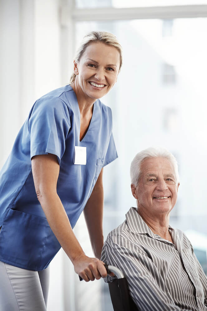Nurse Comforting Elderly Woman at Nursing Home Colleyville