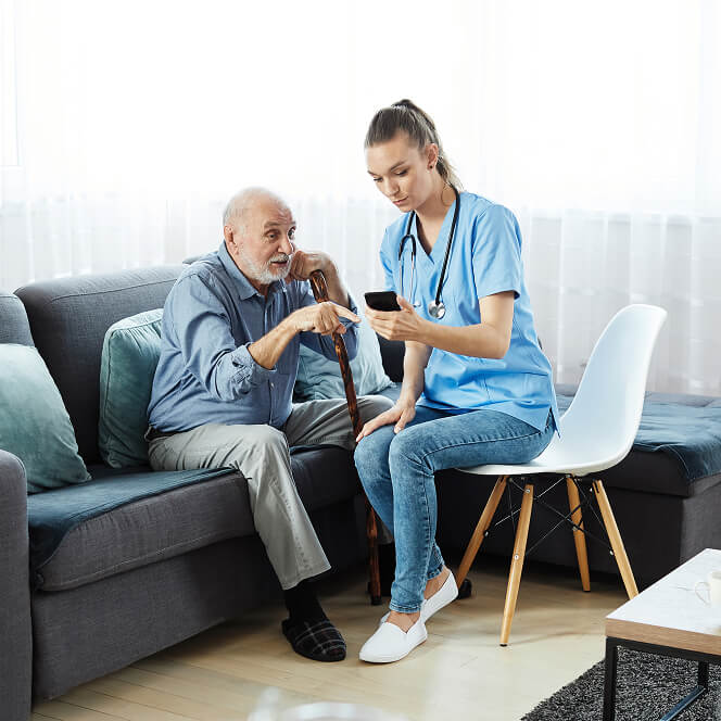 Caregiver Comforting Resident at Memory Care Facility